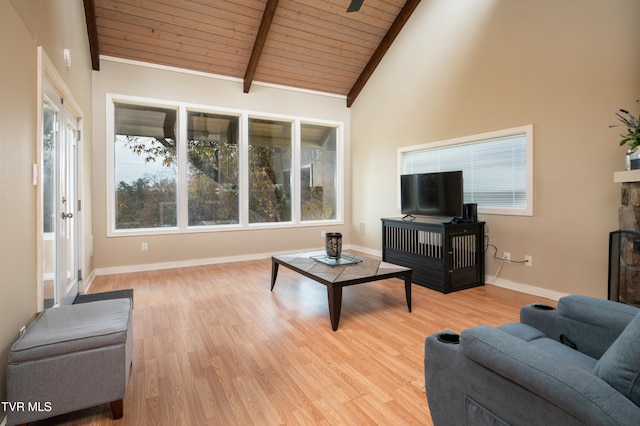 living room with beamed ceiling, high vaulted ceiling, light hardwood / wood-style flooring, and wooden ceiling