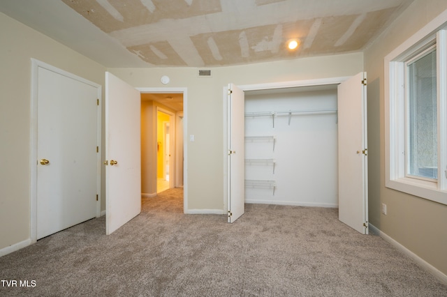 unfurnished bedroom with light carpet