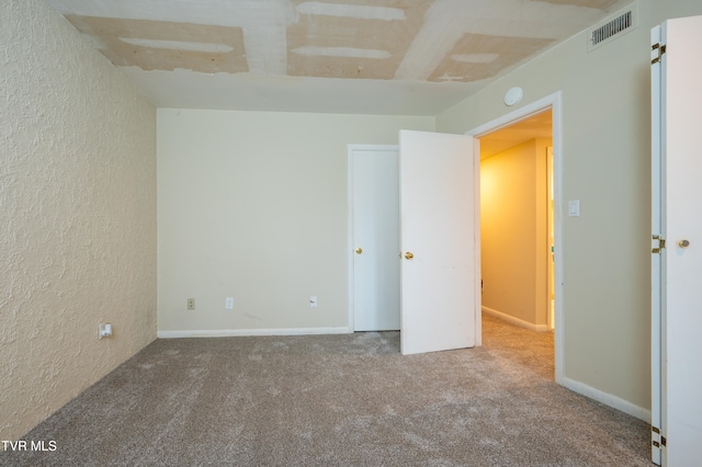 unfurnished bedroom with carpet