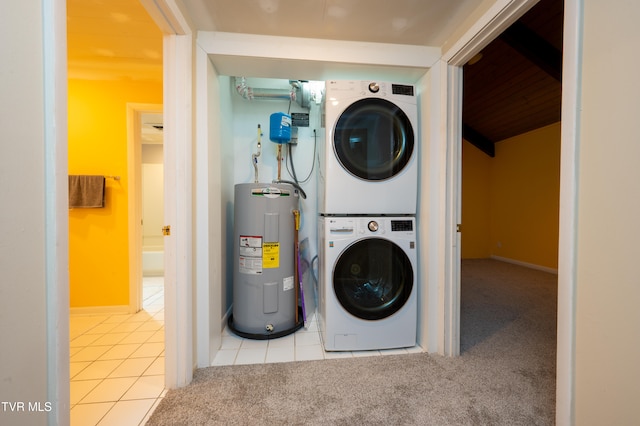 laundry room featuring light colored carpet, electric water heater, and stacked washer and clothes dryer