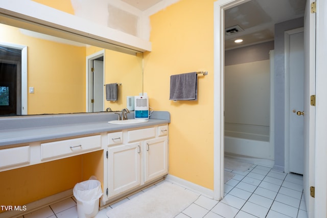 bathroom featuring tile patterned flooring and vanity