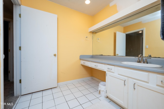 bathroom with tile patterned floors and vanity