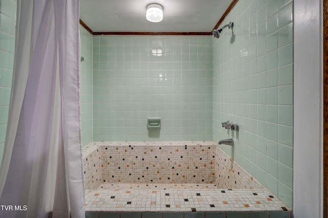 bathroom with a shower with curtain and ornamental molding