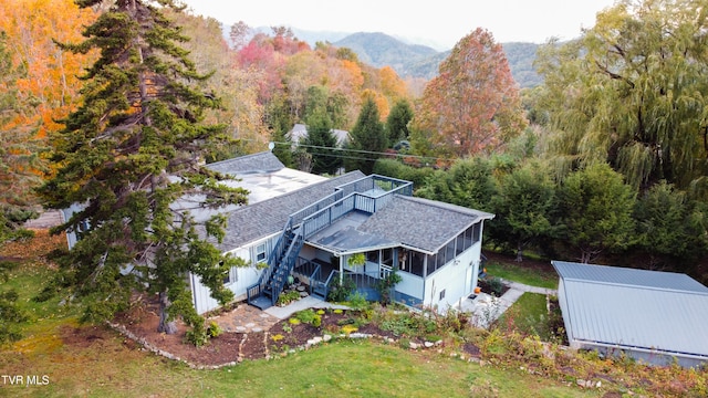 birds eye view of property featuring a mountain view