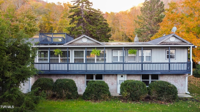 539 Burbank Rd, Roan Mountain, TN 37687 - back of house featuring a sunroom