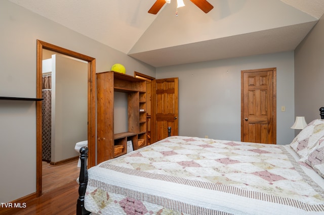 bedroom featuring ceiling fan, wood-type flooring, and lofted ceiling