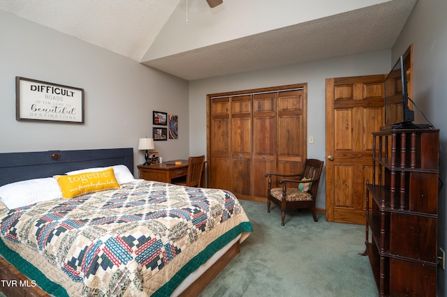 carpeted bedroom with a textured ceiling, a closet, and ceiling fan