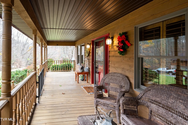 wooden terrace featuring a porch