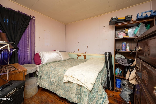 bedroom featuring dark hardwood / wood-style flooring