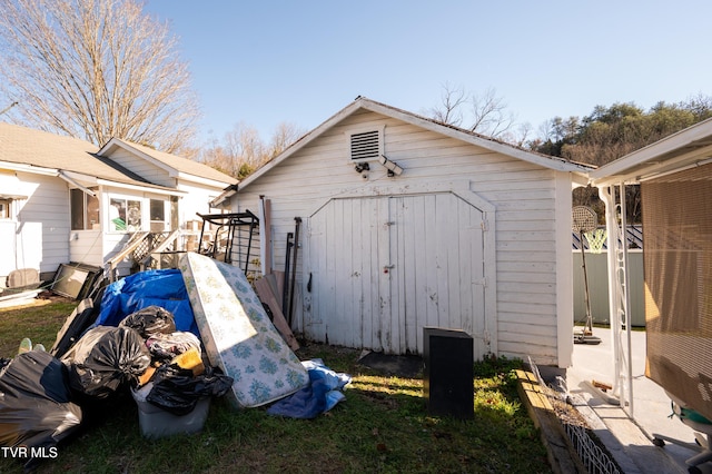 view of property exterior with a storage shed