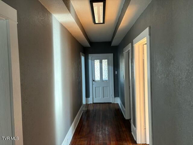911 Russell St, Bristol, VA 24201 - hallway featuring dark wood-style flooring and a textured wall