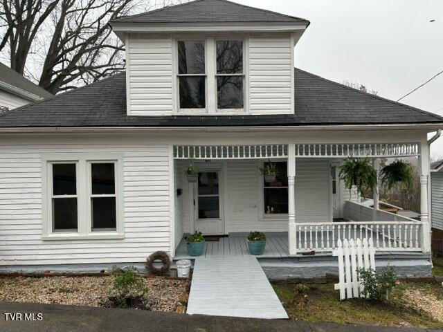 911 Russell St, Bristol, VA 24201 - view of front of property with covered porch and roof with shingles