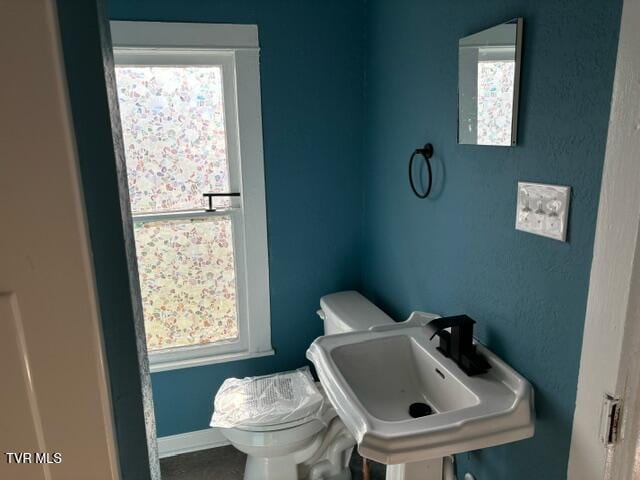 bathroom featuring sink and toilet