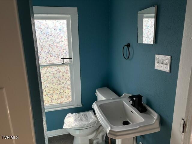 911 Russell St, Bristol, VA 24201 - half bathroom featuring healthy amount of natural light