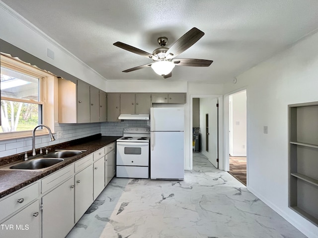 kitchen with white appliances, backsplash, sink, gray cabinets, and a textured ceiling