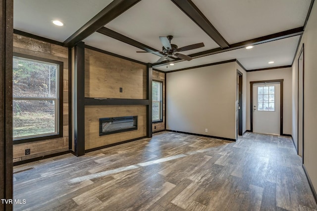 unfurnished living room with crown molding, beam ceiling, ceiling fan, and light wood-type flooring