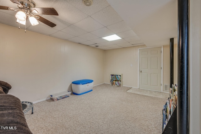 game room featuring carpet flooring, a paneled ceiling, and ceiling fan