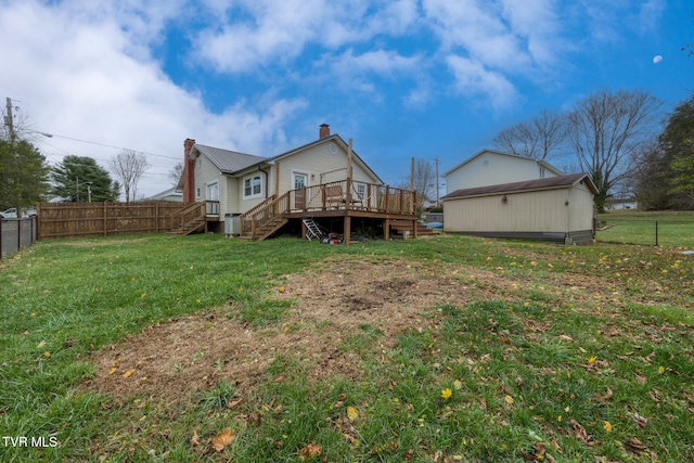 back of house featuring a lawn, a wooden deck, and cooling unit