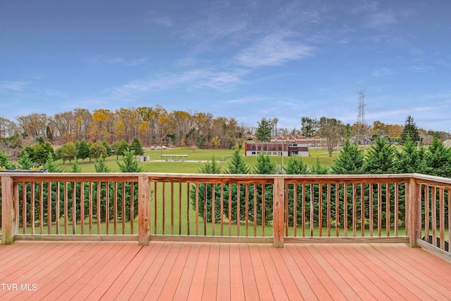 wooden terrace with a yard