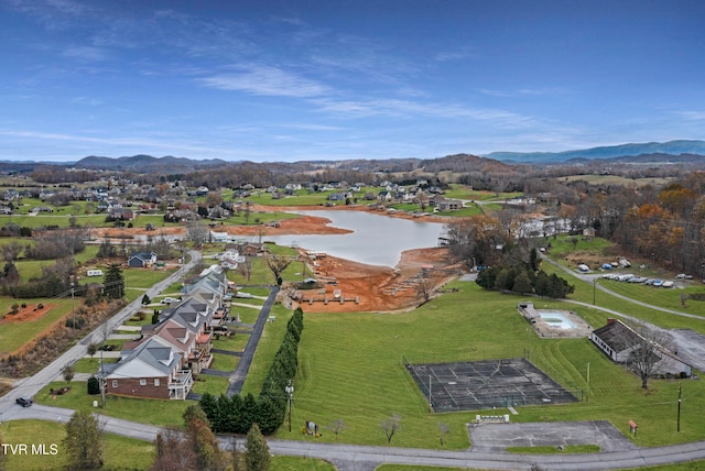 aerial view featuring a water and mountain view