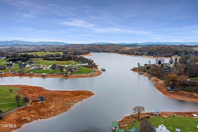 aerial view featuring a water and mountain view