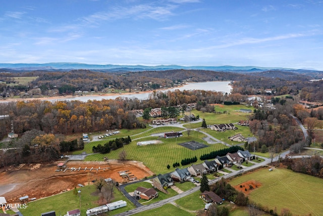 birds eye view of property featuring a water and mountain view