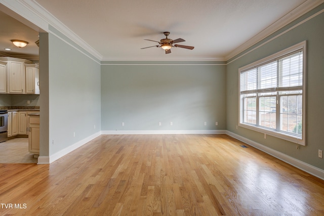 unfurnished room with ceiling fan, ornamental molding, and light wood-type flooring