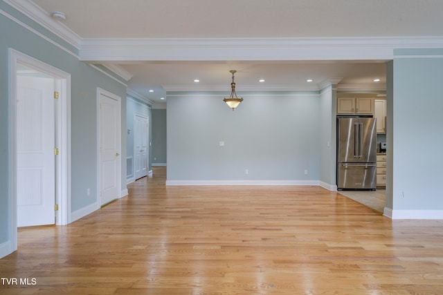 unfurnished living room featuring light hardwood / wood-style floors and ornamental molding