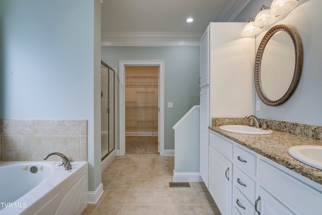 bathroom with tile patterned floors, plus walk in shower, vanity, and ornamental molding