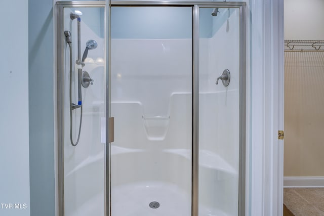 bathroom featuring an enclosed shower