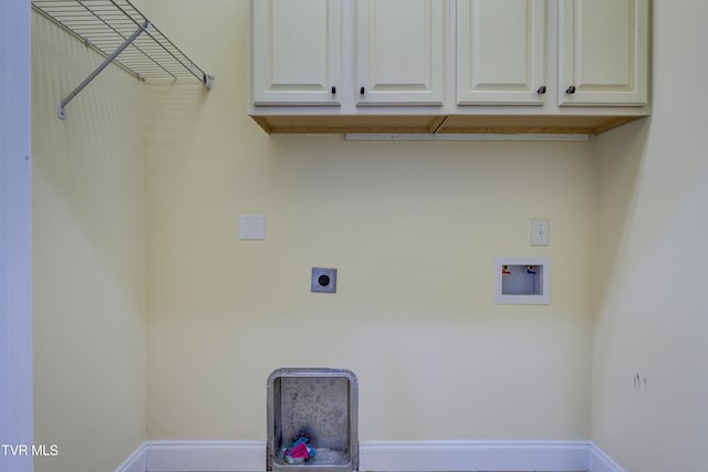 washroom with hookup for an electric dryer, cabinets, and washer hookup