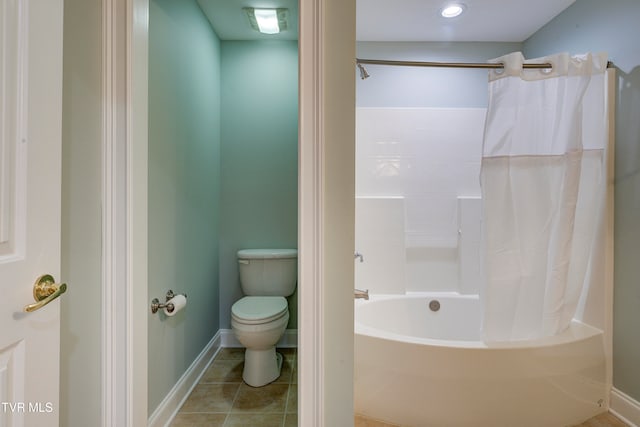 bathroom with shower / bath combo, toilet, and tile patterned floors