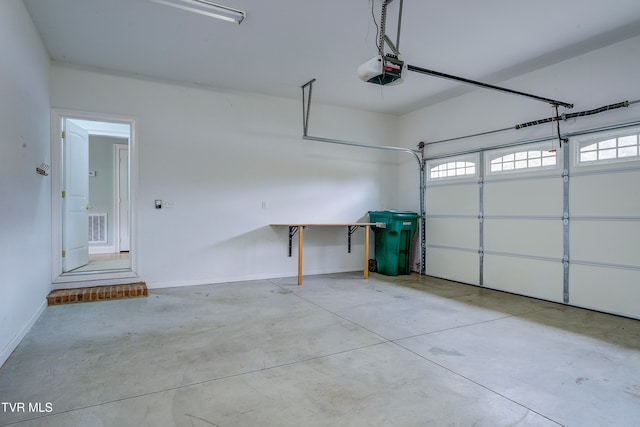 garage featuring a garage door opener