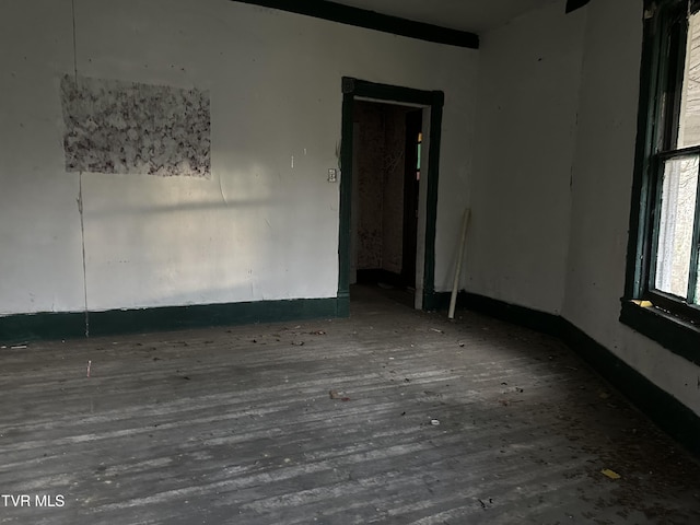 unfurnished room with hardwood / wood-style floors