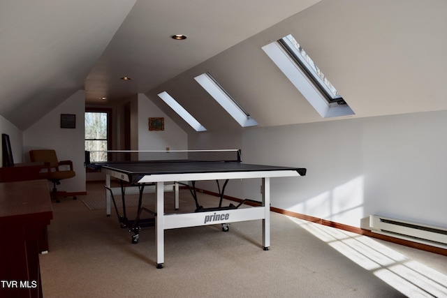 rec room with carpet flooring, a baseboard heating unit, and vaulted ceiling