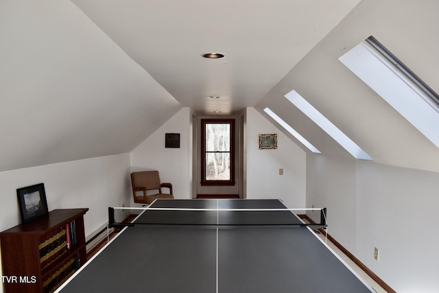 recreation room featuring lofted ceiling with skylight