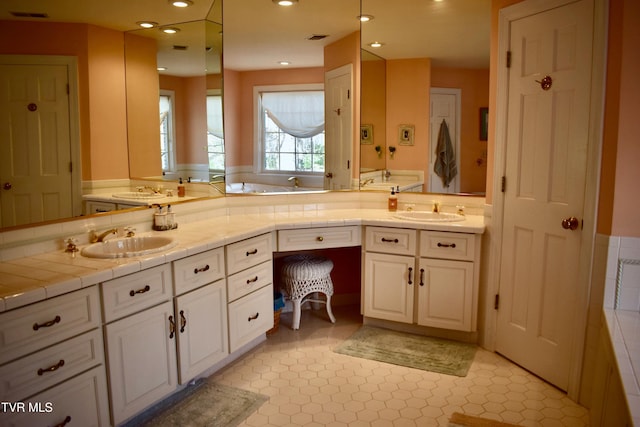 bathroom featuring tile patterned floors and vanity