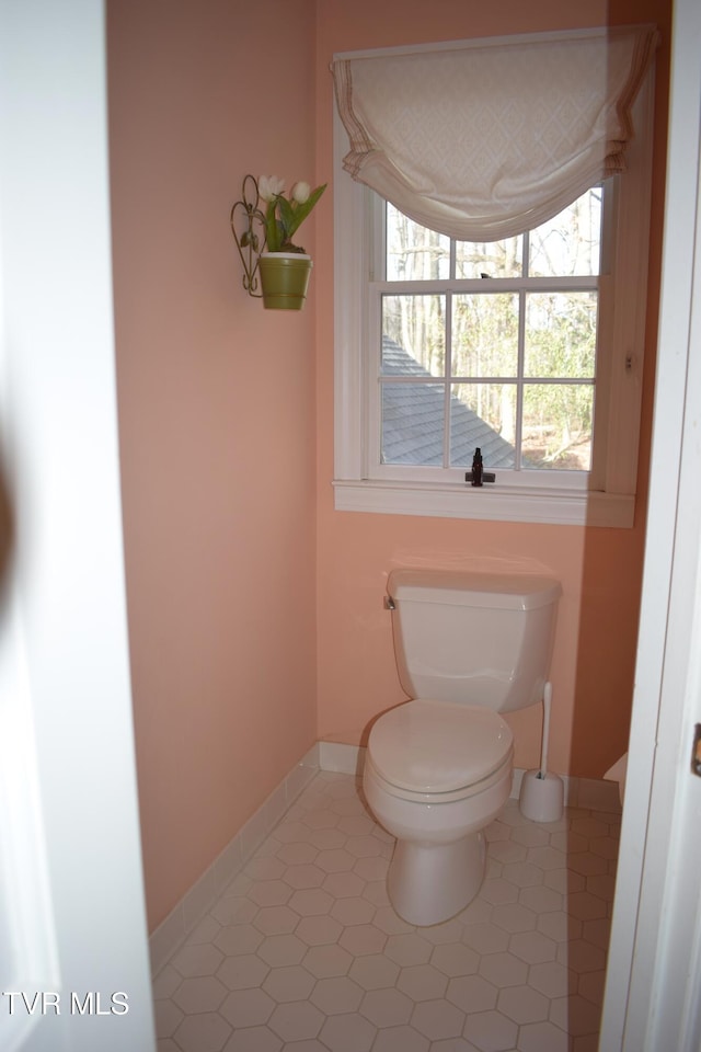 bathroom featuring tile patterned flooring and toilet