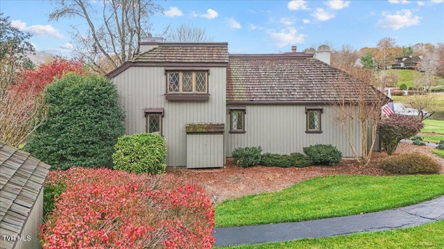 view of home's exterior with a yard