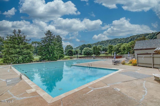 view of swimming pool with a patio