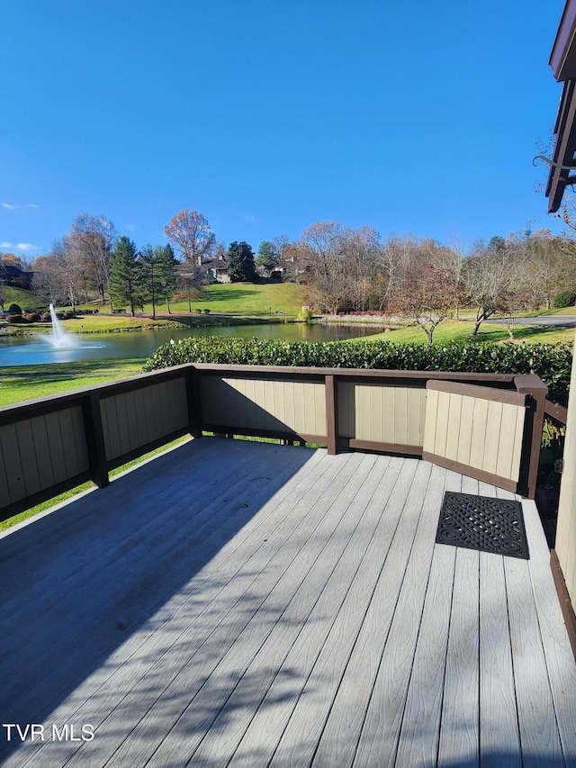 wooden deck with a water view