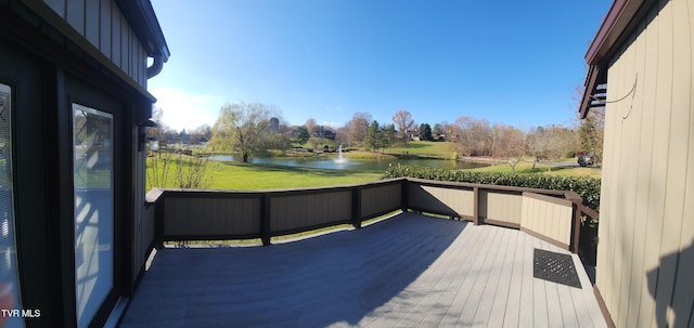 wooden terrace with a water view