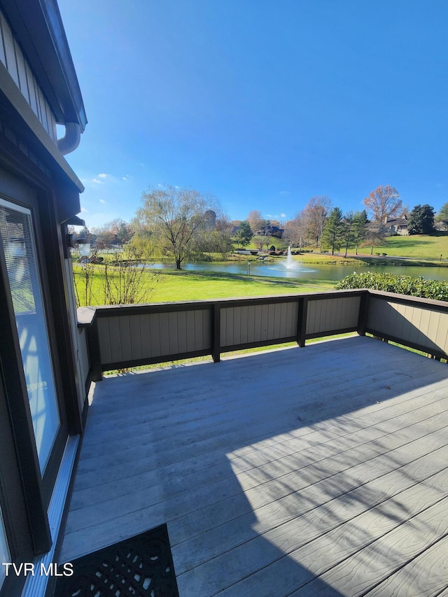 wooden deck with a water view