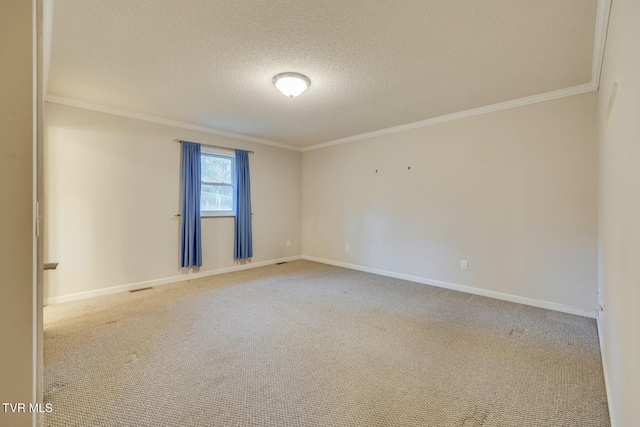 unfurnished room with carpet flooring, a textured ceiling, and ornamental molding