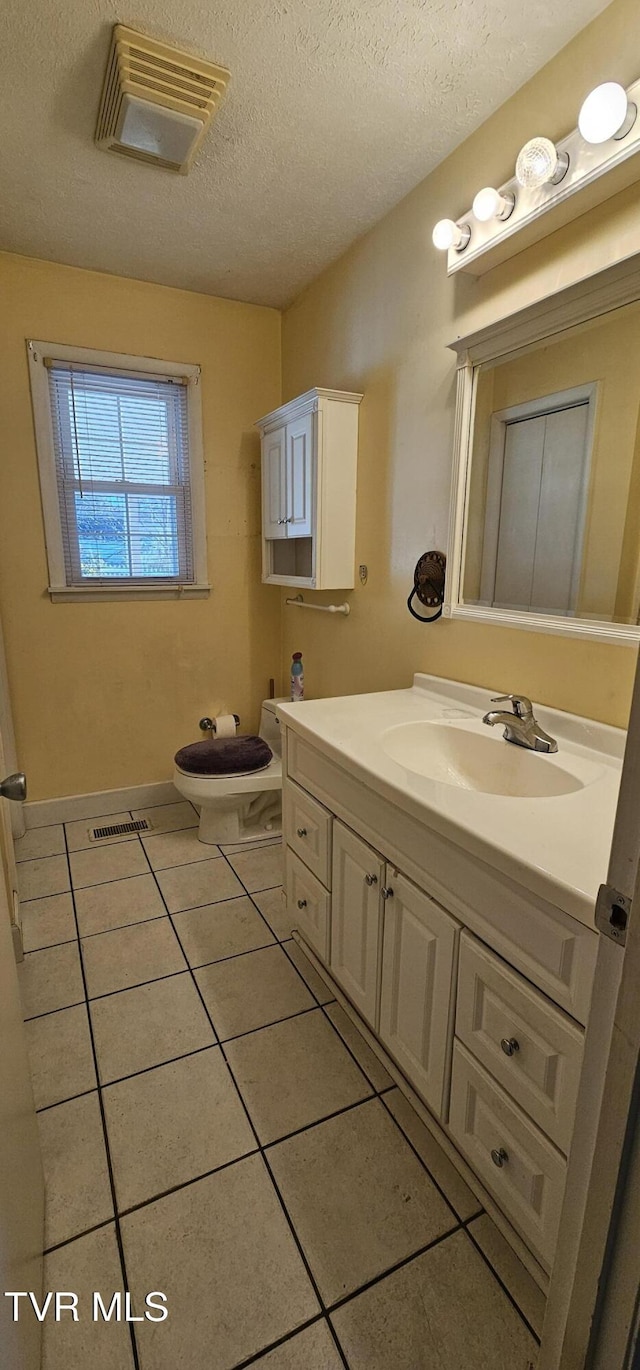 20286 Shadowood Cir, Meadowview, VA 24361 - bathroom featuring vanity, tile patterned flooring, and a textured ceiling