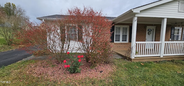 20286 Shadowood Cir, Meadowview, VA 24361 - view of home's exterior featuring brick siding and covered porch