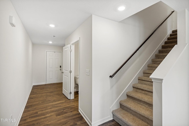 stairway featuring hardwood / wood-style floors