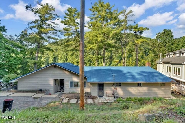 rear view of property featuring a patio area