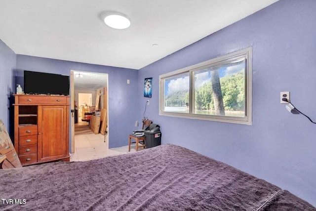 bedroom with light tile patterned floors