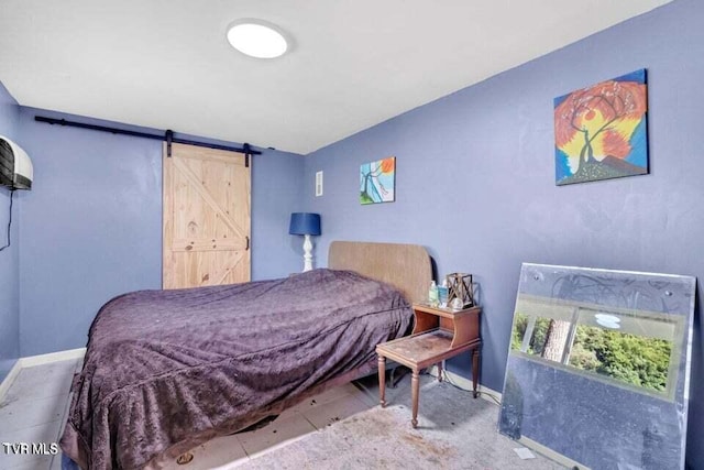 bedroom with a barn door